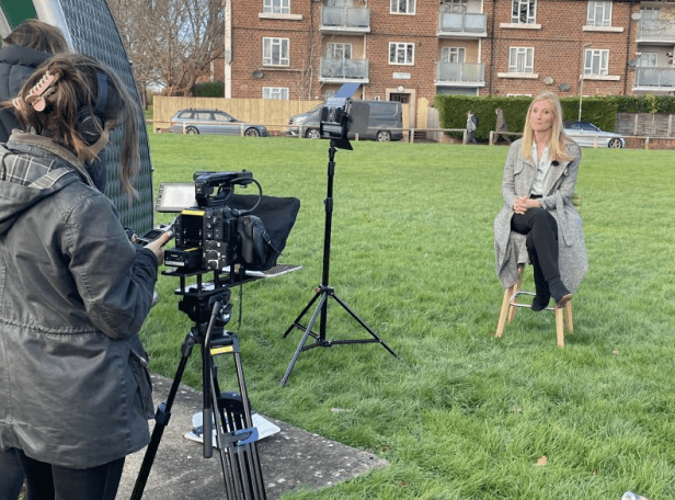 A person being filmed.